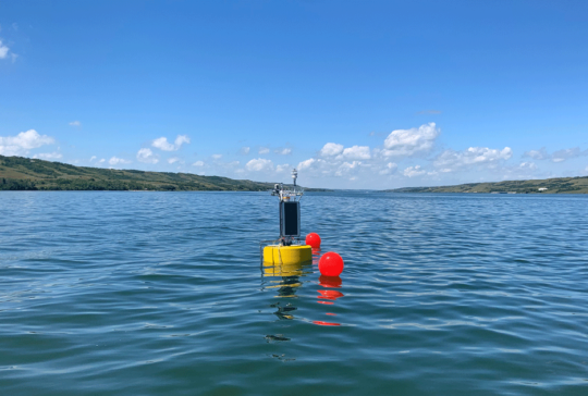 super buoy floating in ocean water