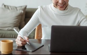 A woman using her computer.