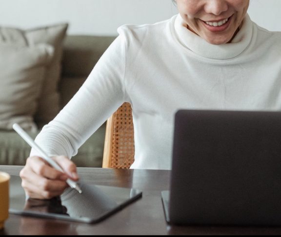 A woman using her computer.