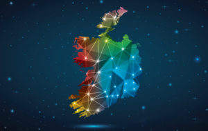 Abstract Polygon Map of Ireland. Vector Illustration Low Poly Color Rainbow on Dark Background.