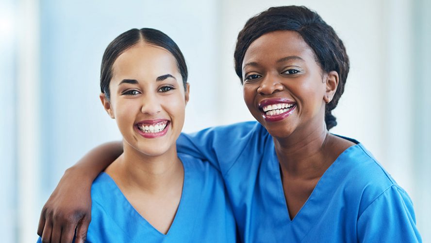 Two smiling nurses