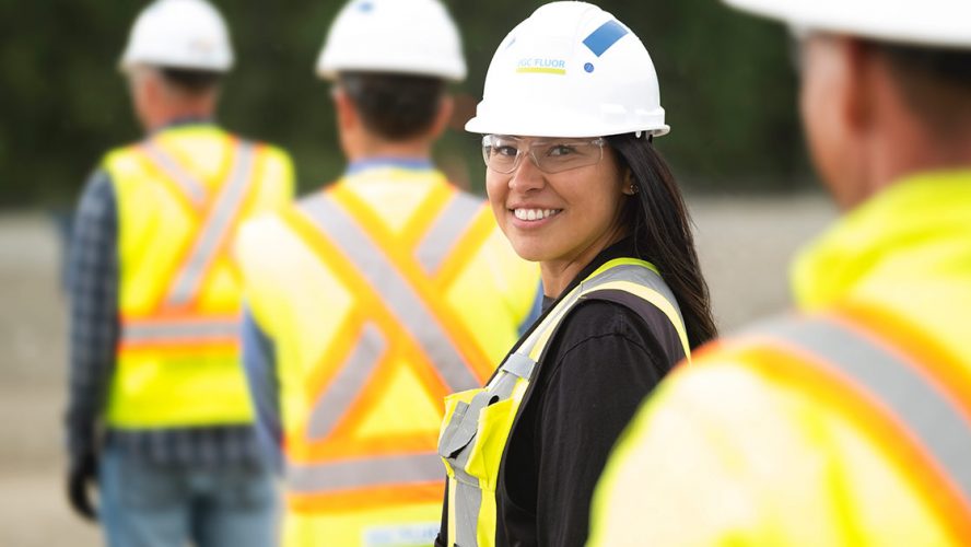 Smiling female construction worker