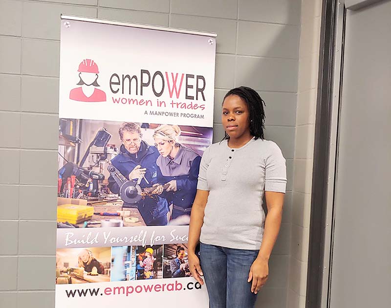 black woman standing beside empowerab
