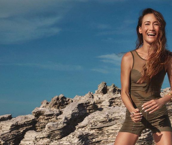 Maggie Q at the beach smiling