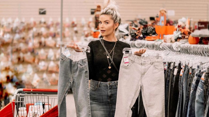 Sarah Nicole Landry shopping for pants in Value Village