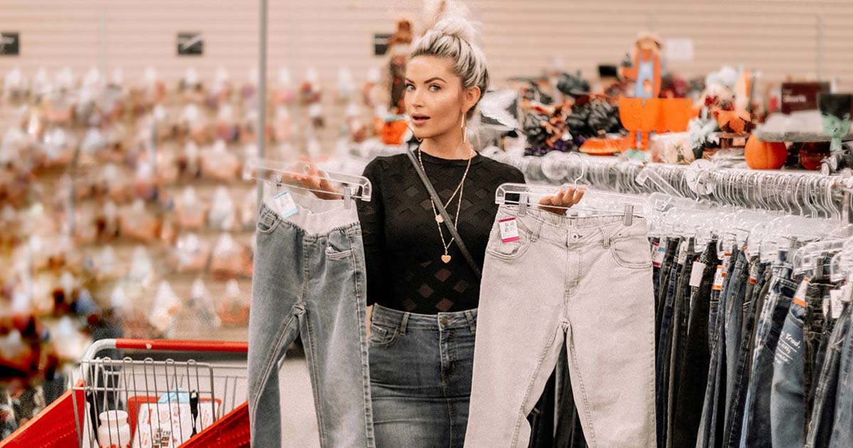 Sarah Nicole Landry shopping for pants in Value Village