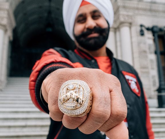 Nav Bhatia showing his Toronto Raptors We the North ring