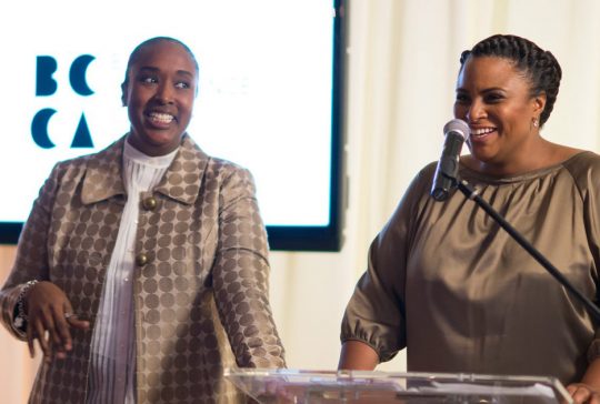 Dr. Jill Andrew and Aisha Fairclough speaking at an event