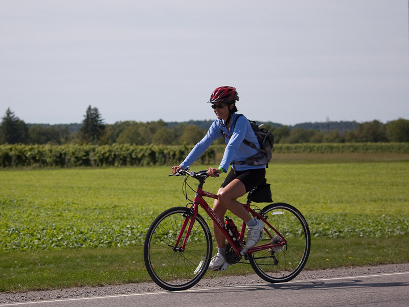 Woman riding bike down the road