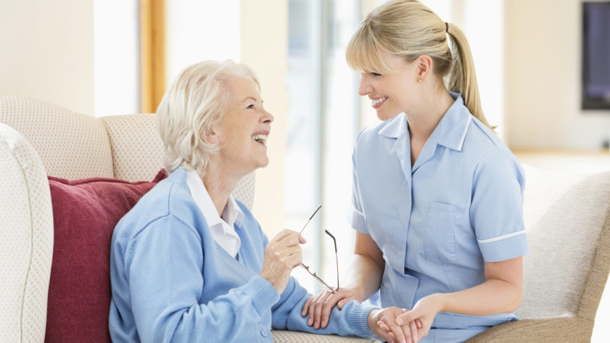 Caregiver talking with older woman