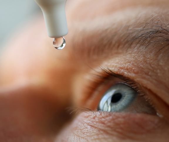 Man drops eye drops install lenses, moisturizing