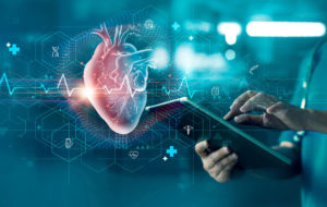 Cardiologist doctor examine heart functions and check up report electronic medical record of patient on tablet.