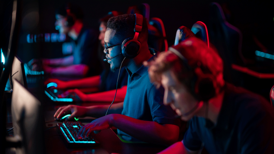Professional esports players at an online game tournament. The cyber team plays computers and trains