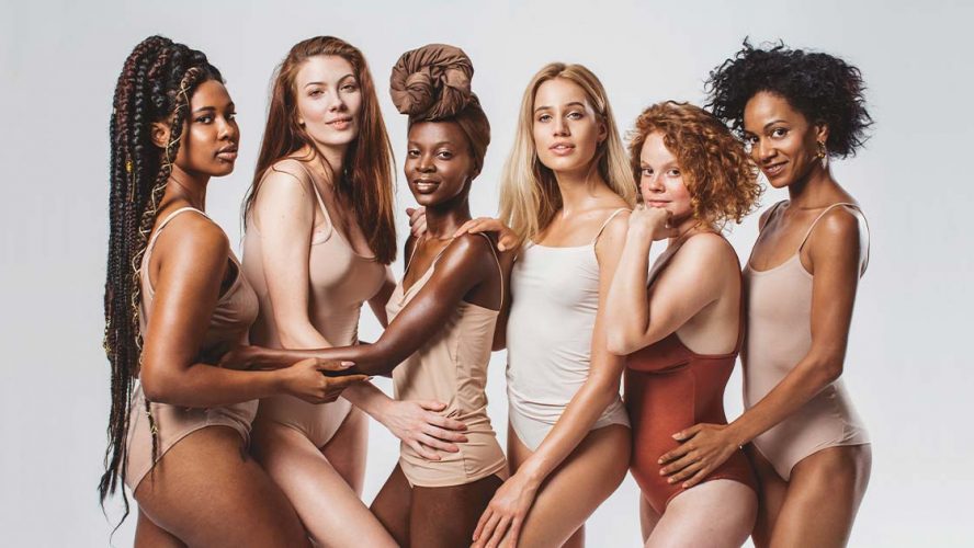 Diverse crew of women in nude-coloured body suits