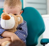 Kid-holding-onto-stuffed-bear