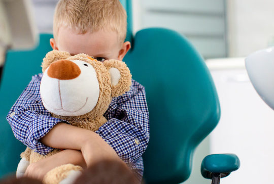 Kid-holding-onto-stuffed-bear