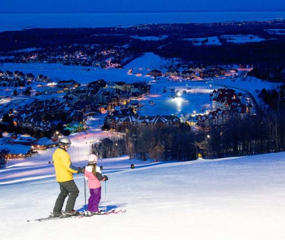 Child skiing with parent_Marriott_bonvoy_hotel