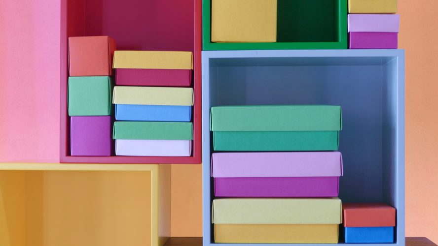 Multi colored boxes in the shelf