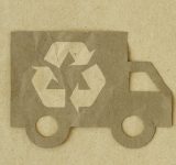 Paper cut of truck with recycling symbol on recycled paper background - Green transportation concept