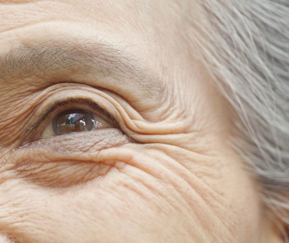 Close up of older Chinese woman’s eye